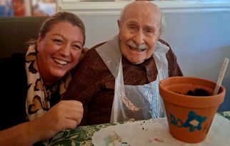 laura-tighe-md-white-oaks-takes-part-in-volunteering-with-a-resident.jpg
