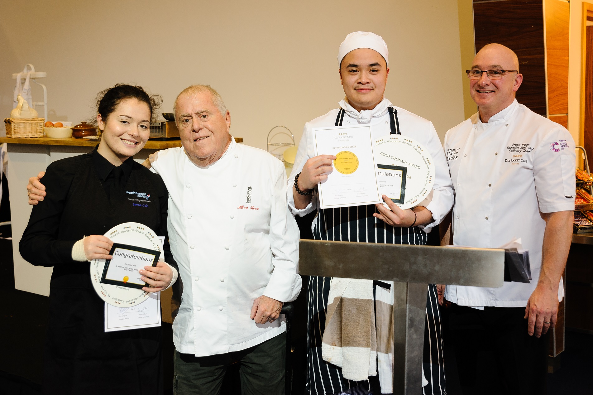 Albert Roux, second from the left, and Frazer Wilson, right, with Thames College Hospitality and Catering Academy student