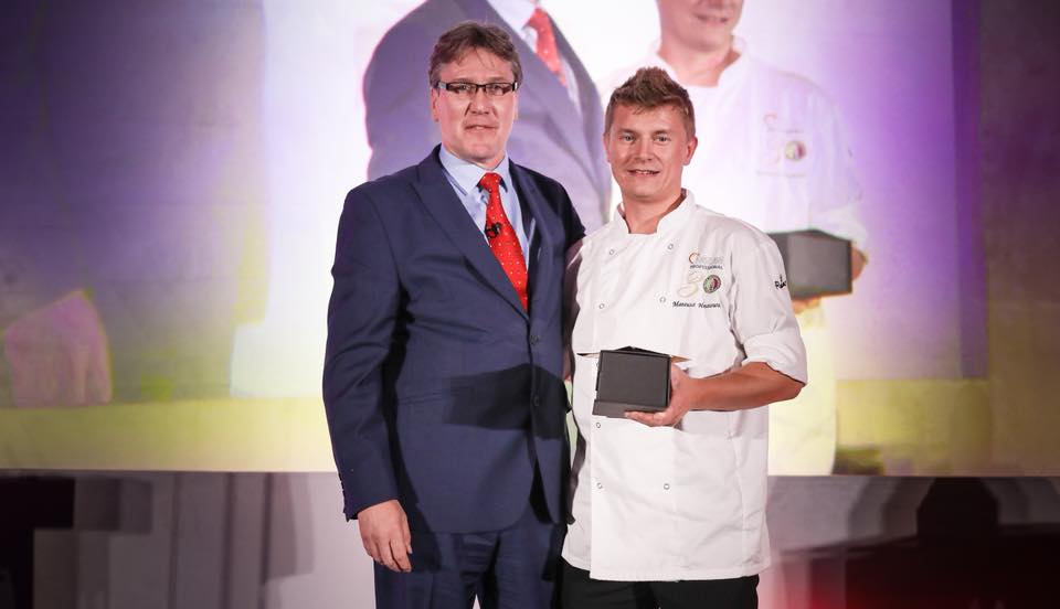 Mateusz receiving the award at The Dorchester Hotel
