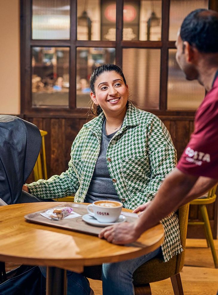 one_costa_barista_serving_woman_with_pram_square-min.jpg