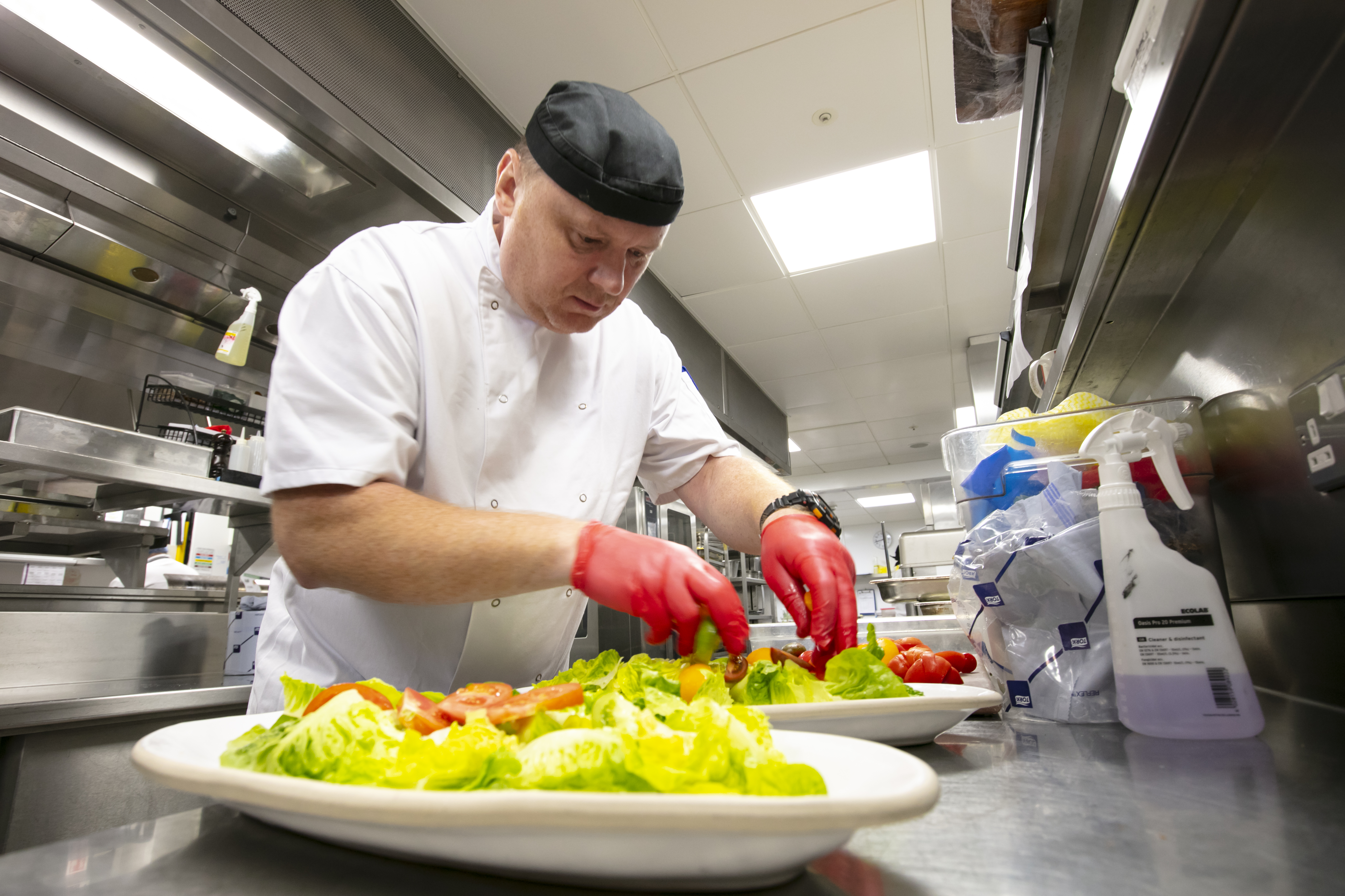 Compass chef preparing food, Stop Food Waste Day